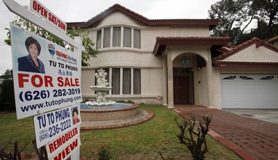 
              In this Thursday Nov. 8, 2012, photo, a house is shown "for sale" in Monterrey Park, Calif.  Average U.S. rates on fixed mortgages ticked up this week just slightly above their record l